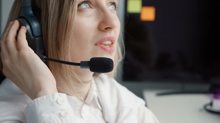 Support professional with a headset providing live client support