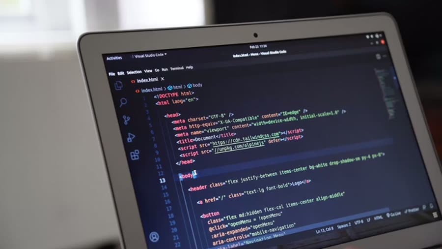 Developer typing code on a dark screen